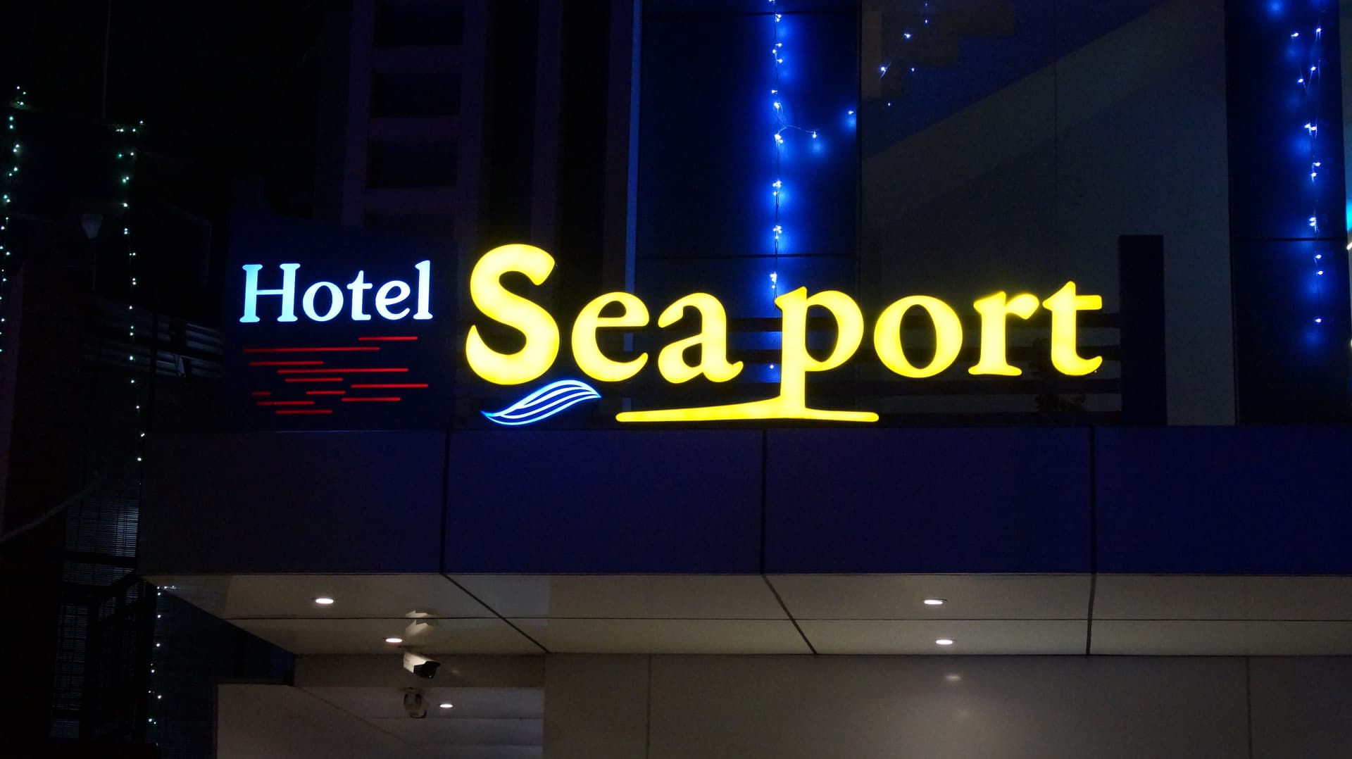 Hotel Sea Port — Neon-Lit Corridor